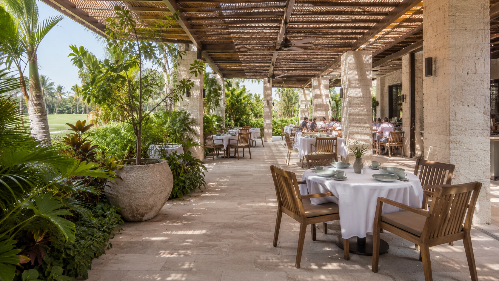 Concept of a shaded, open-air club dining terrace
